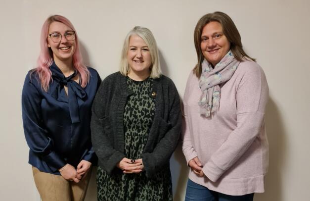 Sara, Katie and Julia, our Carer Enquiries team smiling at camera